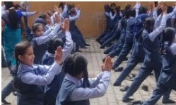 Students doing group yoga exercises
